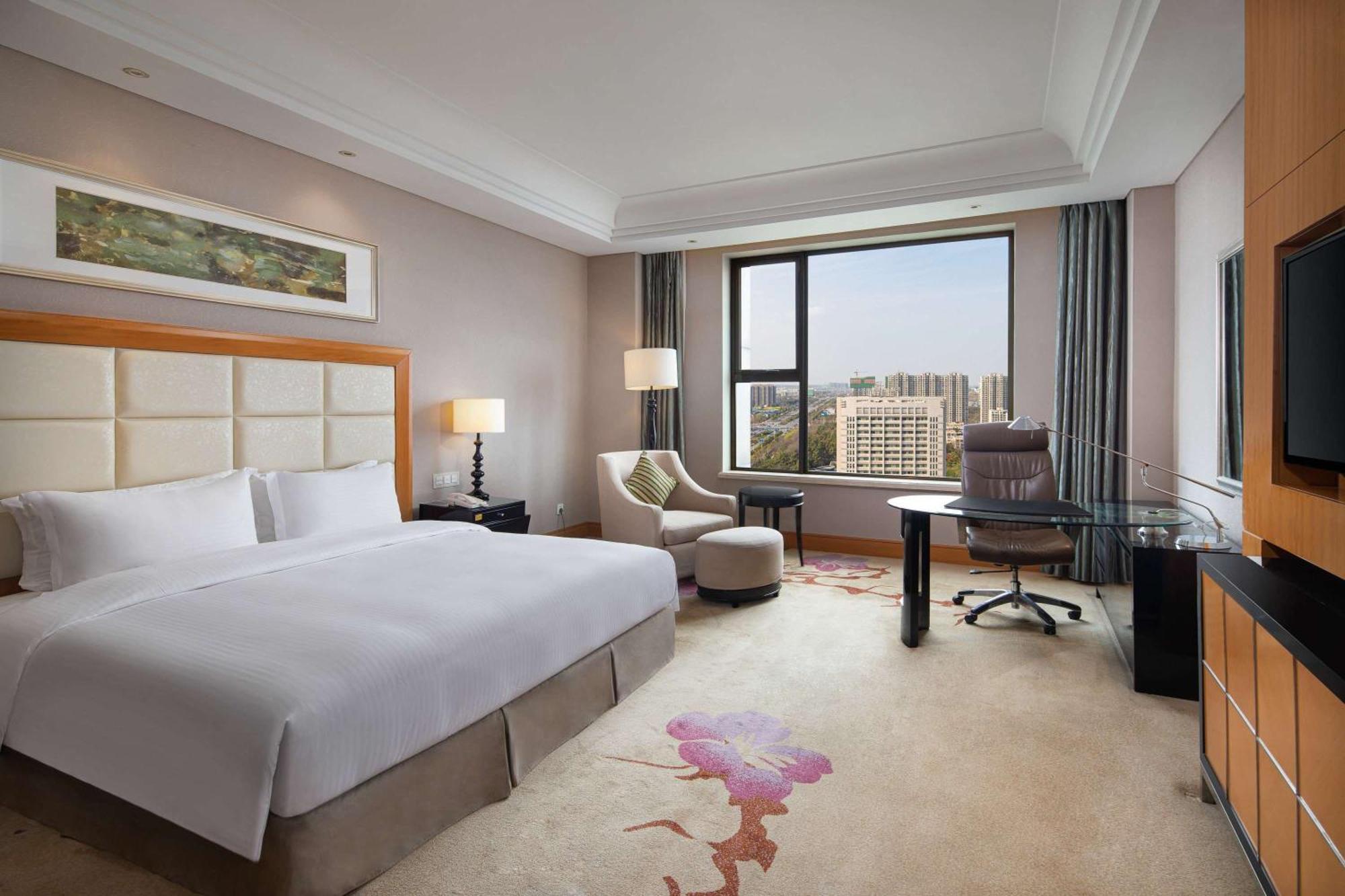 Wyndham Xinyang Downtown Hotel Buitenkant foto